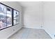 A bright bedroom featuring a large black frame window and white trim at 927 Contento St, Sarasota, FL 34242