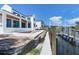 New construction backyard with a dock that gives access to the canal at 927 Contento St, Sarasota, FL 34242