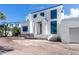 Modern two-story home featuring a clean white facade and large windows at 927 Contento St, Sarasota, FL 34242