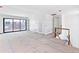Hallway featuring an open area with sliding glass doors and a hallway with interior doors at 927 Contento St, Sarasota, FL 34242