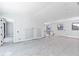 Bright living room with large windows, recessed lighting, and neutral walls at 927 Contento St, Sarasota, FL 34242