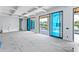Bright living room with coffered ceilings and glass doors offering outdoor views at 927 Contento St, Sarasota, FL 34242
