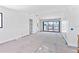 Spacious living room featuring sliding glass doors and neutral color palette at 927 Contento St, Sarasota, FL 34242