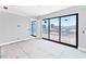 Living room featuring sliding glass doors and neutral color palette at 927 Contento St, Sarasota, FL 34242