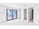 Living room featuring sliding glass doors and neutral color palette at 927 Contento St, Sarasota, FL 34242