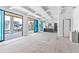 Spacious living room with coffered ceilings and sliding glass doors leading to a patio at 927 Contento St, Sarasota, FL 34242