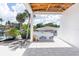Spacious outdoor patio, covered for all-weather use, with new construction details at 927 Contento St, Sarasota, FL 34242
