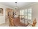 Charming dining room with shuttered windows, chandelier, and an open layout at 11744 Shirburn Cir, Parrish, FL 34219