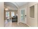 Inviting entryway with decorative front door, light wood floors, and view of the living room at 11744 Shirburn Cir, Parrish, FL 34219
