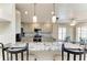 Beautiful kitchen features an island with seating, stainless steel appliances, and updated cabinets at 11744 Shirburn Cir, Parrish, FL 34219