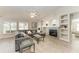 Spacious living room featuring vaulted ceilings, fireplace, and abundant natural light at 11744 Shirburn Cir, Parrish, FL 34219