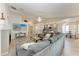 Open-concept layout showcases a large living room connected to the kitchen and dining area at 11744 Shirburn Cir, Parrish, FL 34219