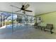 Relaxing screened patio with ceiling fan overlooking pool and pond at 11744 Shirburn Cir, Parrish, FL 34219
