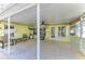 Spacious screened patio with fan, seating and view of backyard at 11744 Shirburn Cir, Parrish, FL 34219