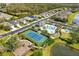 Community aerial view of swimming pool, tennis court, playground and pond at 12019 Sawgrass Lake Ter, Bradenton, FL 34211
