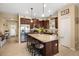 Bright kitchen boasts a large granite island, stainless steel appliances, and plenty of cabinet space at 12019 Sawgrass Lake Ter, Bradenton, FL 34211