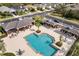 Inviting community pool with shade structures and ample seating at 12019 Sawgrass Lake Ter, Bradenton, FL 34211