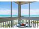 Stunning ocean view from the balcony with outdoor seating, featuring clear blue skies and refreshing sea breezes at 1255 Tarpon Center Dr # 315, Venice, FL 34285