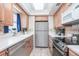Efficient kitchen featuring stainless steel appliances, sleek countertops, and ample cabinet space at 1255 Tarpon Center Dr # 315, Venice, FL 34285