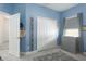 Cozy Bedroom includes a gray dresser, closet, and a window with blinds and curtains at 13540 Old Creek Ct, Parrish, FL 34219
