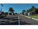 Community entrance gate flanked with decorative pillars, signage and landscaping at 13540 Old Creek Ct, Parrish, FL 34219