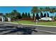 Community entrance sign with beautiful landscaping and shrubbery, 'Canoe Creek Love Where Life Leads' at 13540 Old Creek Ct, Parrish, FL 34219