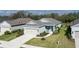 Inviting single-story home featuring a landscaped lawn and an attached two-car garage at 13540 Old Creek Ct, Parrish, FL 34219