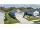 Landscaped home featuring a well-manicured lawn, a two-car garage, and sidewalks at 13540 Old Creek Ct, Parrish, FL 34219