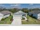 Charming single-story home with a well-manicured lawn and a two-car garage at 13540 Old Creek Ct, Parrish, FL 34219