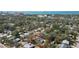 Aerial view of a residential area, showcasing a home with a large driveway and lush, mature trees nearby at 1367 21St St, Sarasota, FL 34234