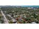 Aerial view of a home nestled in a lush, tree-filled neighborhood, outlined in red at 1367 21St St, Sarasota, FL 34234