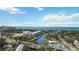 Scenic aerial view of waterfront condos with a harbor and city skyline in the distance at 1367 21St St, Sarasota, FL 34234
