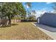 Large backyard with green lawn and wooden fence at 1367 21St St, Sarasota, FL 34234