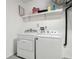 Functional laundry area equipped with a standard washer and dryer at 1367 21St St, Sarasota, FL 34234