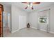 Bedroom with a fan, double door closet and a window with natural light at 14730 1St E Ave, Bradenton, FL 34212