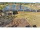 Aerial view of the community park showcasing a playground, lake, and picnic pavilion at 14730 1St E Ave, Bradenton, FL 34212