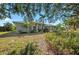 Well-maintained home featuring manicured landscaping and mature trees enhancing its curb appeal at 14730 1St E Ave, Bradenton, FL 34212