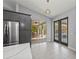 Bright kitchen featuring stainless steel appliances and views of the outdoor patio and pool area at 14730 1St E Ave, Bradenton, FL 34212