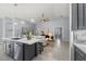 Kitchen with marble island, stainless steel dishwasher, and open view to the living room at 14730 1St E Ave, Bradenton, FL 34212