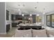 Open floor plan with modern kitchen, island seating, and stainless steel appliances at 14730 1St E Ave, Bradenton, FL 34212