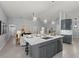Open-concept kitchen featuring modern pendant lighting and stainless steel appliances at 14730 1St E Ave, Bradenton, FL 34212