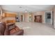 Living area showing kitchen, lounge space, and access to other spaces at 14730 1St E Ave, Bradenton, FL 34212