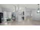 Open-concept living room with modern furnishings and bright, neutral tones at 14730 1St E Ave, Bradenton, FL 34212