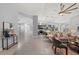 Bright and airy living space featuring an open floor plan, a modern kitchen, and tile floors at 14730 1St E Ave, Bradenton, FL 34212