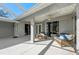 Covered outdoor patio with comfortable seating, perfect for relaxation and enjoying the outdoor space at 14730 1St E Ave, Bradenton, FL 34212