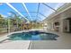 Private screened-in pool area with spacious patio and tropical landscaping views, ideal for relaxation at 14730 1St E Ave, Bradenton, FL 34212
