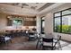 Modern amenity room featuring a stylish kitchen, bar seating, and several tables to entertain guests at 14803 Derna Ter, Bradenton, FL 34211