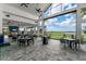 Bright amenity room with high ceilings, ceiling fans, and large windows overlooking the community golf course at 14803 Derna Ter, Bradenton, FL 34211