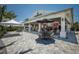 Outdoor bar with a covered patio and comfortable seating at 14803 Derna Ter, Bradenton, FL 34211
