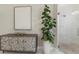 Modern bathroom with a patterned cabinet, statement art, and a glass-enclosed shower at 14803 Derna Ter, Bradenton, FL 34211